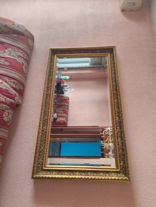 Espejo decorativo dorado con marco de madera