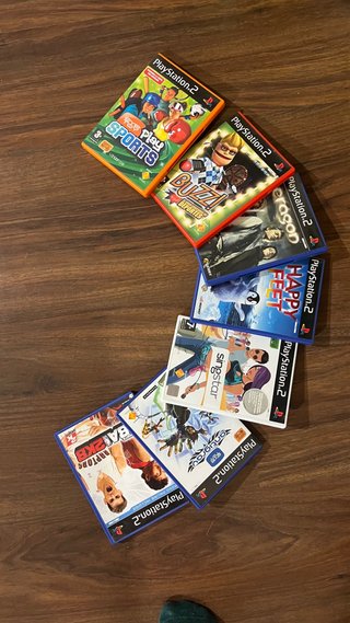 PlayStation 2 con 7 juegos y guitarhero