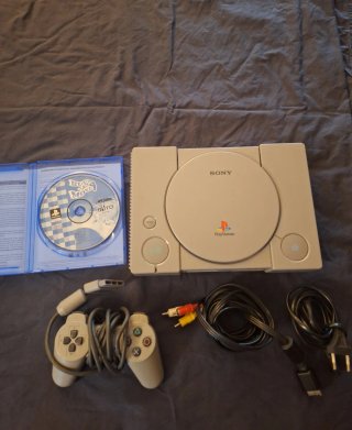 Console PlayStation 1 con Bust-a-Move 4