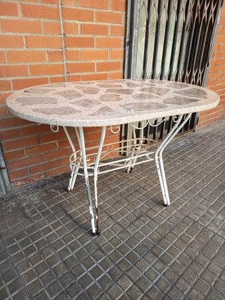 Mesa ovalada de terraza piedra y metal