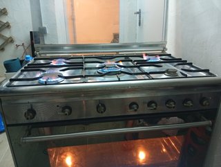Cocina de gas con horno eléctrico