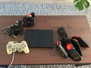 Consola PlayStation 2 (PS2) con mandos Buzz