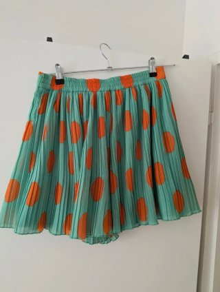 Falda-pantalón plisada naranja y turquesa