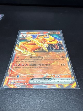 Carta Pokémon Charizard ex precio mercado 12$