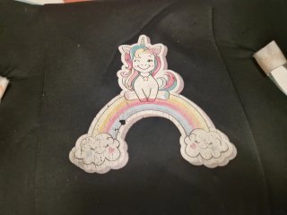 Alzador de coche infantil con unicornio