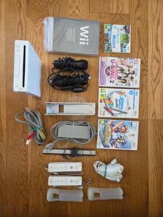 Consola Nintendo Wii con accesorios y juegos