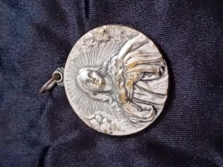 Medalla religiosa circular