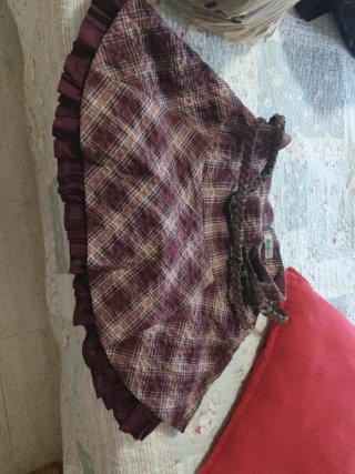 Falda corta de cuadros con cinturón