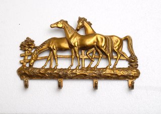 Perchero de pared de bronce con caballos