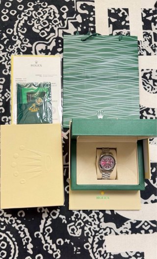 Reloj Rolex con caja y documentación