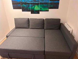 Sofá cama con chaiselongue Skiftebo gris