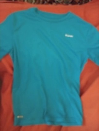 Camiseta Turquesa Tela que no deja pasar los rayos