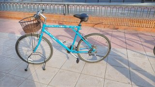 Bicicleta de paseo y montaña 26” turquesa y cesta