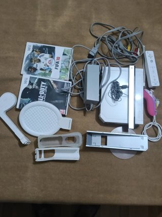 Consola Nintendo Wii con juegos y mando