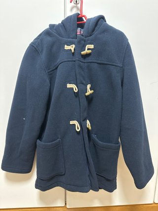Abrigo de paño azul con capucha