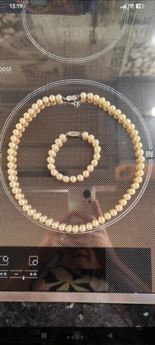 Conjunto de collar y pulsera de perlas