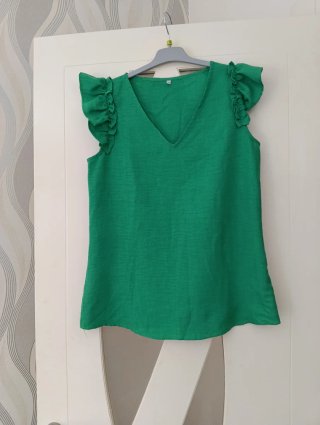 Camiseta sin mangas con volantes verde