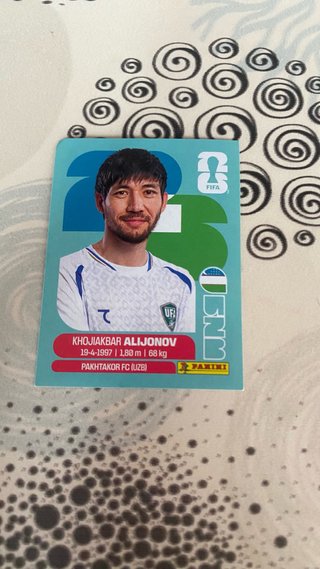 Cromo Panini Mundial FIFA 2026 - Khojiakbar Alijon