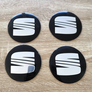 TAPABUJES SEAT 90mm PEGATINA NEGROS EMBLEMA PLATA