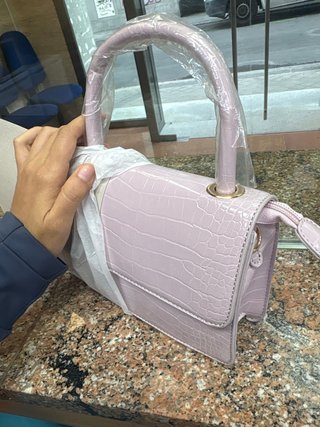 Cartera de mano rosa