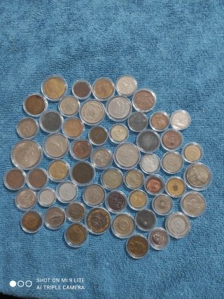 Lote de 54 Monedas Internacionales Encapsuladas