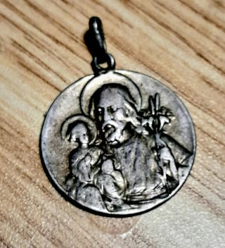Medalla antigua de plata