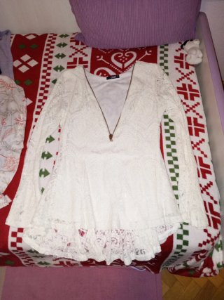 Blusa de encaje blanca Quiz