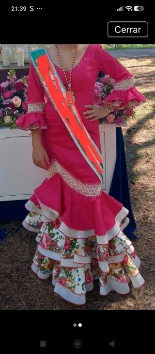 Traje de flamenca rosa con volantes