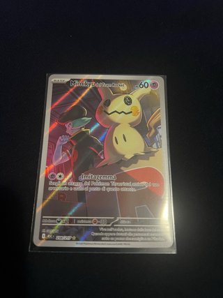 Carta Pokémon Mimikyu del Team Rocket