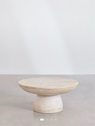Mesa de centro redonda Sklum. Efecto Travertino.