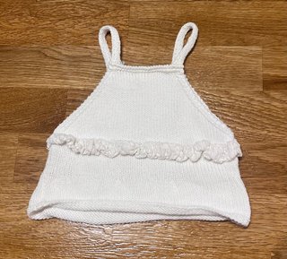 Top de punto blanco para bebé