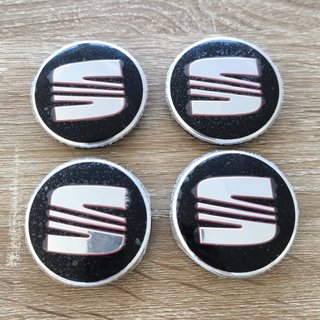 TAPABUJES SEAT 56mm NEGROS - EMBLEMA LLANTAS SEAT