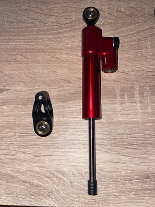 Amortiguador de dirección rojo