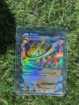 Carta Pokémon M Steelix HOLO Antigua