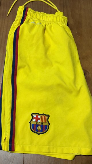 Pantalón corto FC Barcelona amarillo