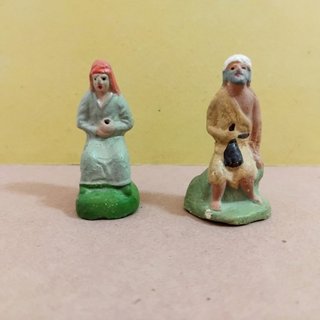Pastor y pastora antiguos de Pesebre en Barro