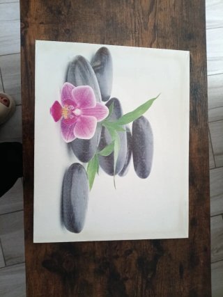 Cuadro decorativo con piedras y orquídea