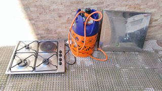 Cocina de gas con botella de butano