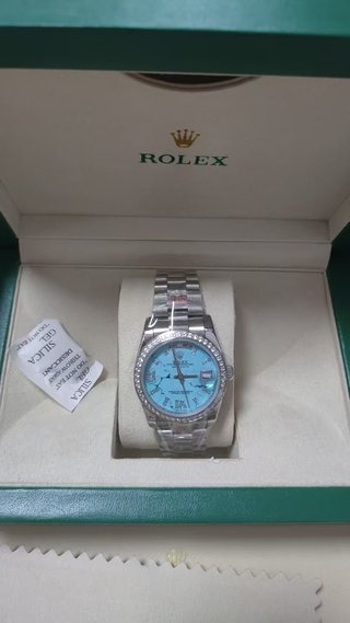Reloj Rolex Plateado y Turquesa