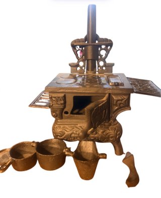 Cocina miniatura de hierro fundido