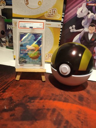 Ultra Ball y Carta Pokémon Psyduck