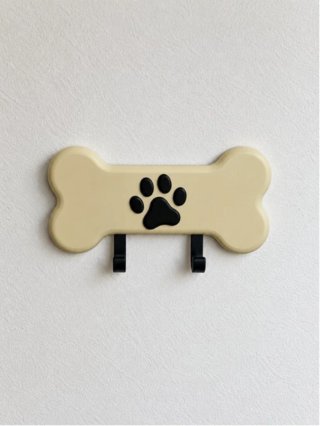 Colgador de pared con forma de hueso