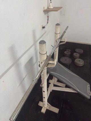 Banco de Pesas con Barra y Discos