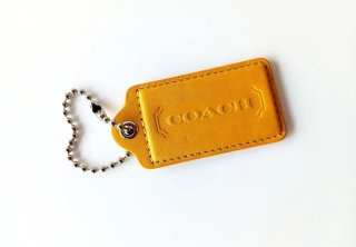 COACH Amarillo Llavero piel 75x40 mm