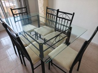 Conjunto de mesa de cristal y 6 sillas