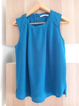 Blusa sin mangas color turquesa