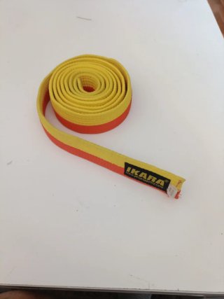 Cinturón de Taekwondo Ikara Amarillo-Naranja