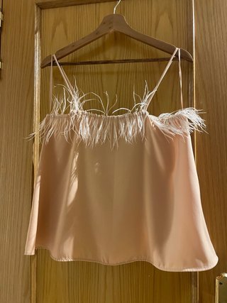 Top lencero Zara con plumas