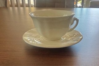 9 Tazas y plato La Cartuja de Sevilla
