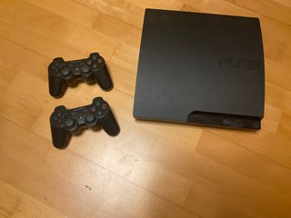 PlayStation3 con 5 juegos y  2 mandos